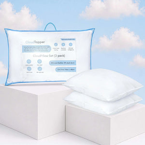 Luxury pillow set with CloudTopper packaging on white display blocks