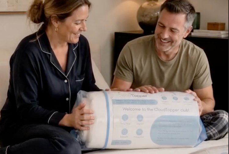 A couple unboxing their CloudTopper together