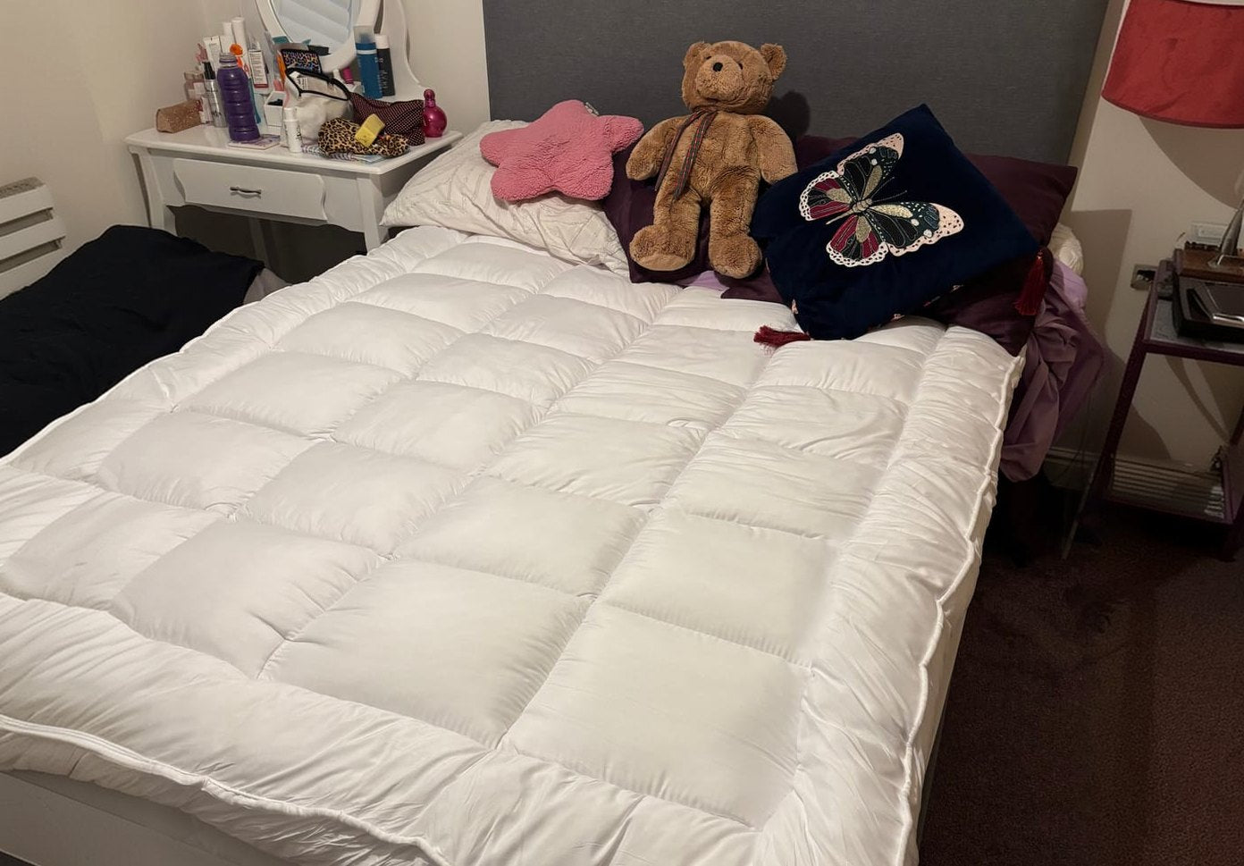 A CloudTopper on a bed in a bedroom